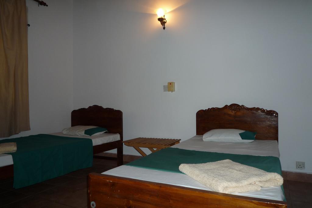 Beach House Negombo Quarto foto